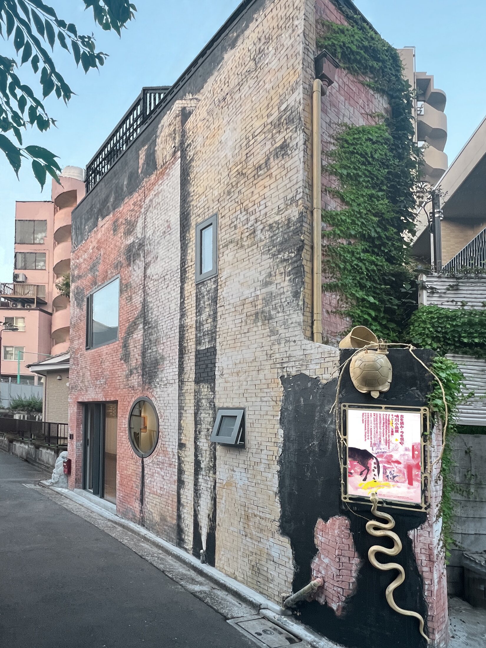 Xuanwu Art Space — façade with the current exhibition poster and the tortoise-and-snake signage